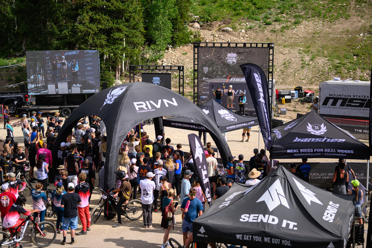 The RIVN tent in the crowd at a Mountain States Cup podium